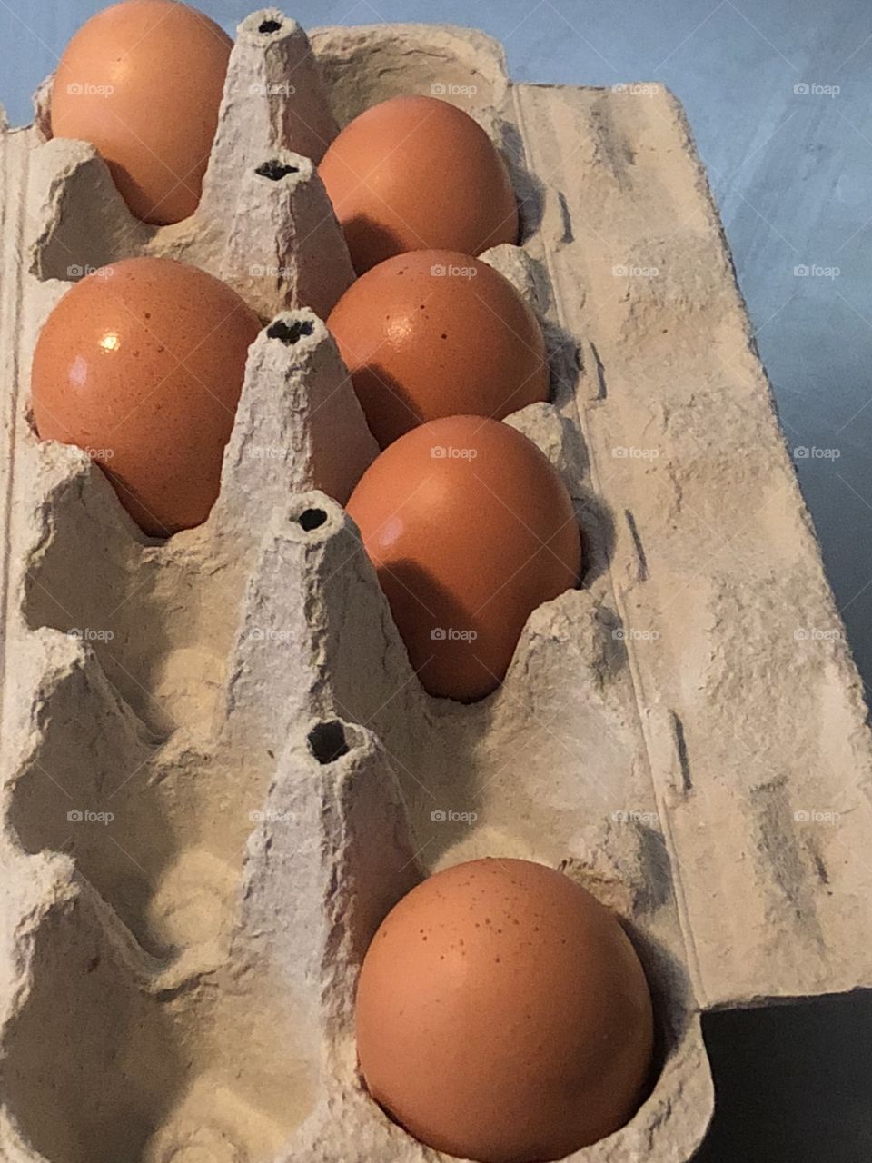 Brown eggs in carton