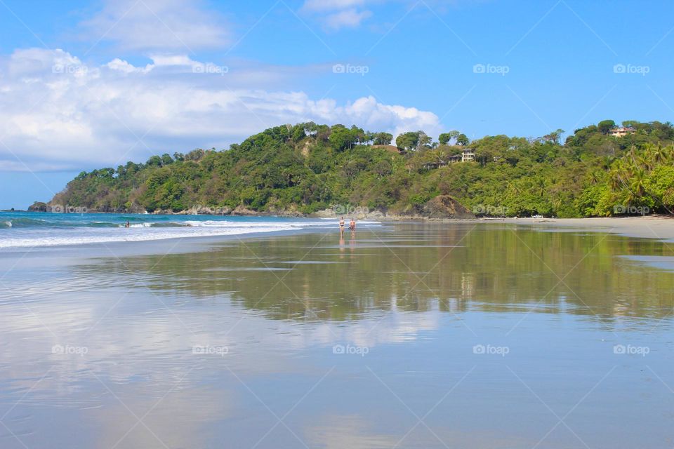 View of the sandy beach with reflection.  Manueloantonio beach.  Costarica