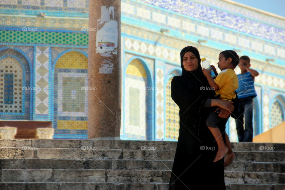 With child woman in veil 