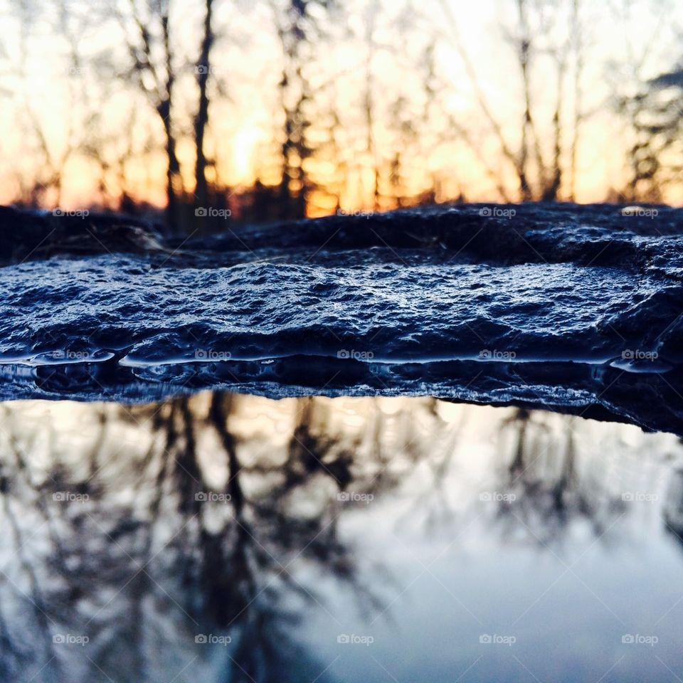 Reflection in a flooded rock