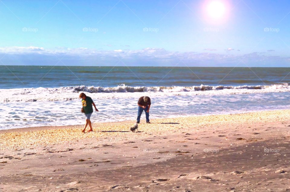 Beachcombers on a sunny day.