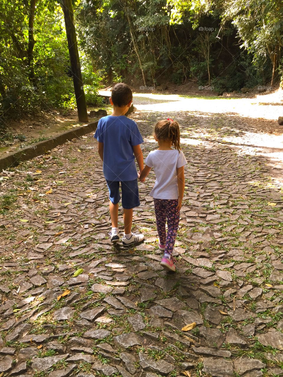 Brother and sister walking together