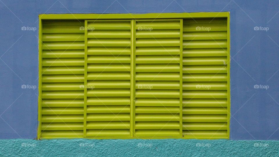 Close-up of green windows on wall