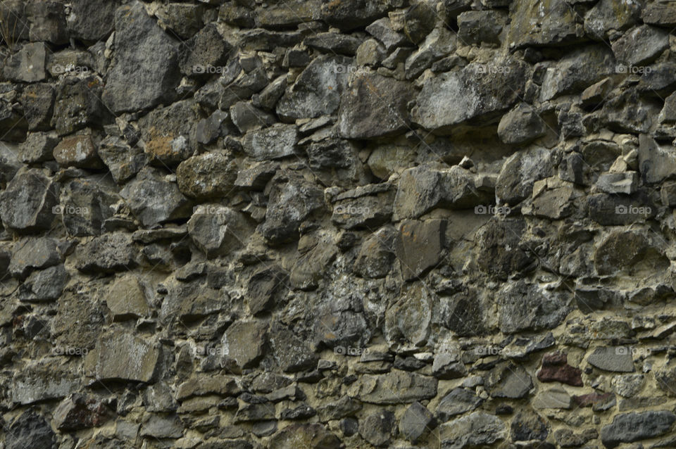 stone wall of Nevitsky castle, Ukraine