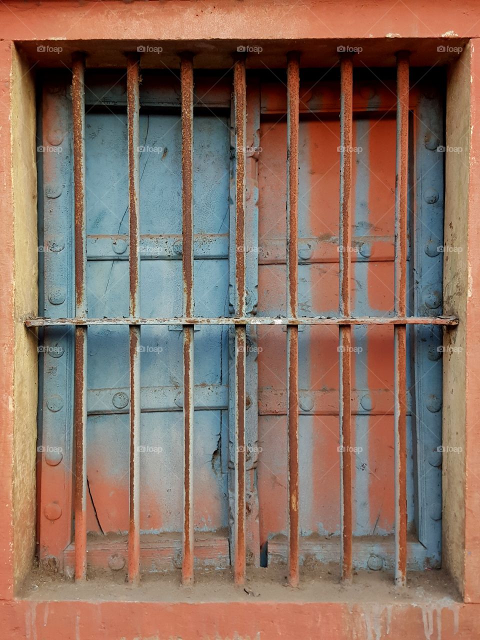 Multi color window with rusted iron