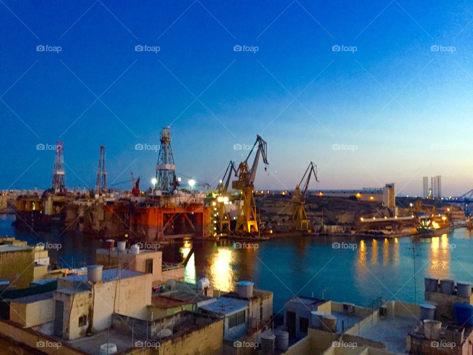 Local colours. Senglea Industrial Dockyard, seen from the rooftops of Senglea, Malta.