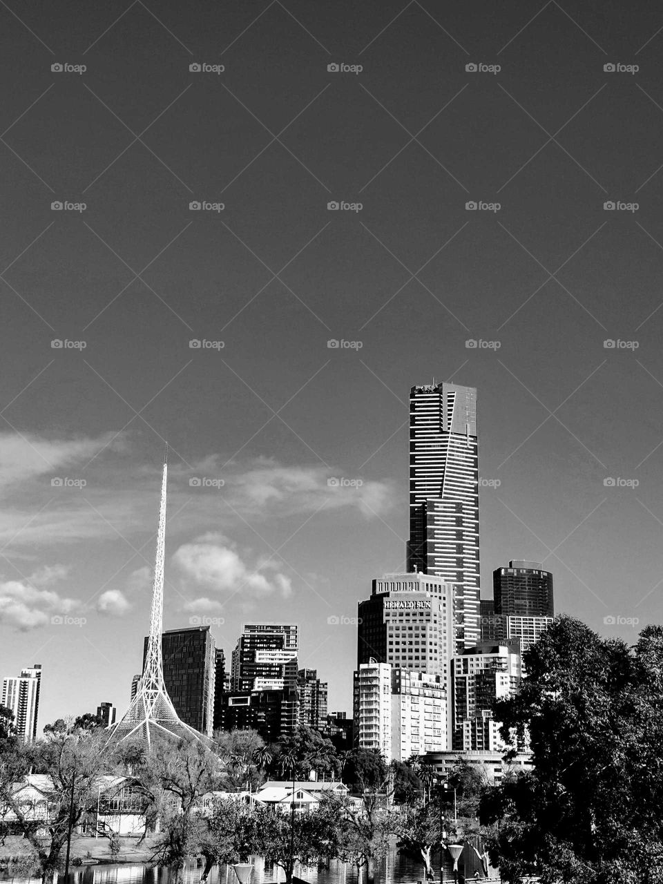 Urban city landscape by the well known Yarra River in Melbourne featuring the art gallery spire