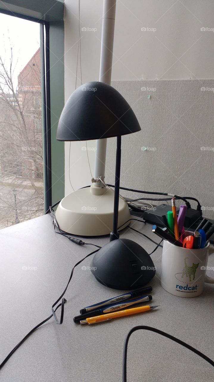 lamp on desk by window