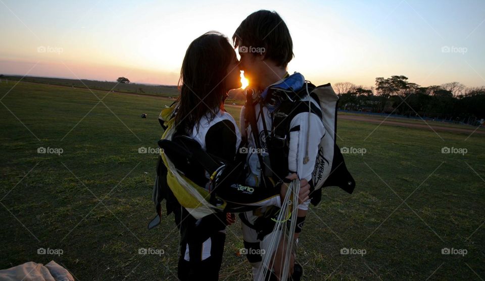 skydiver couple at sunset