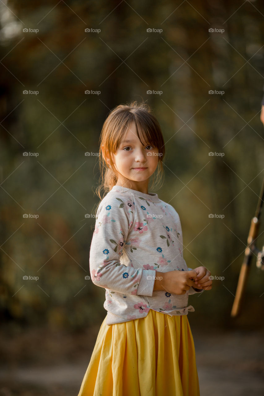 Little girl portrait at autumn day