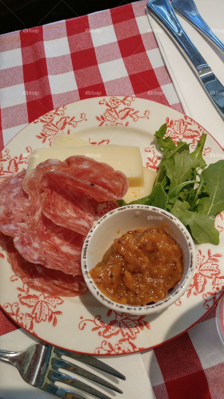 Cured meat and cheese with apricot spread.