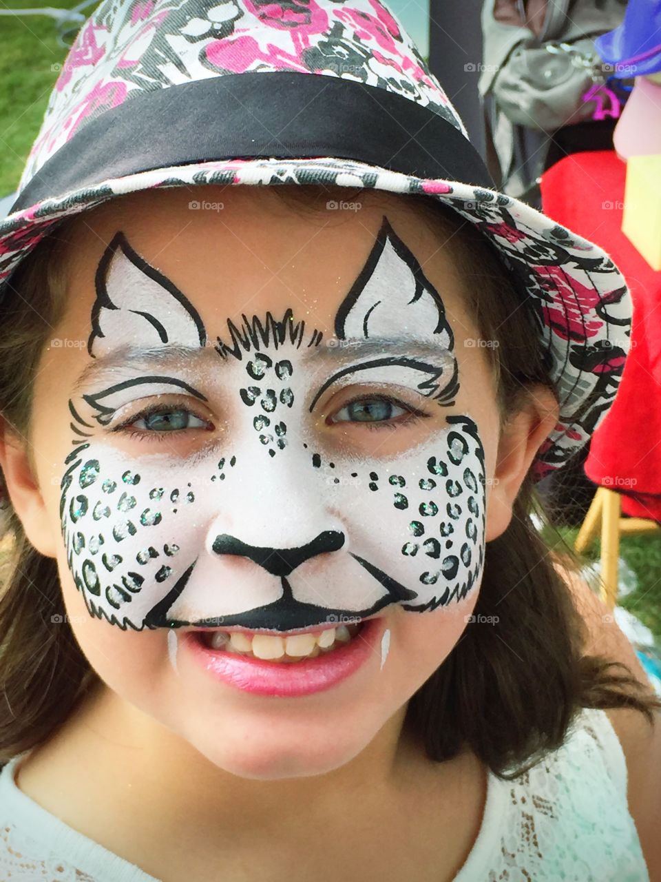 Close-up of a happy girl with face paint