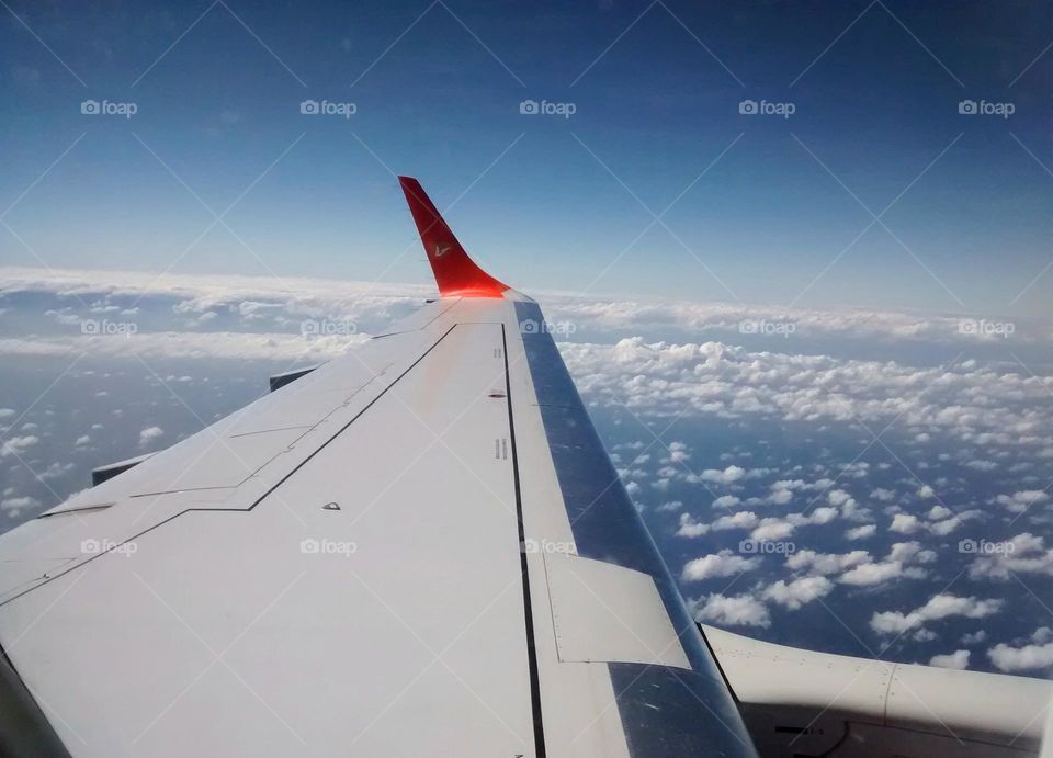 beautiful carpet of clouds in the sky as I fly back to Venezuela