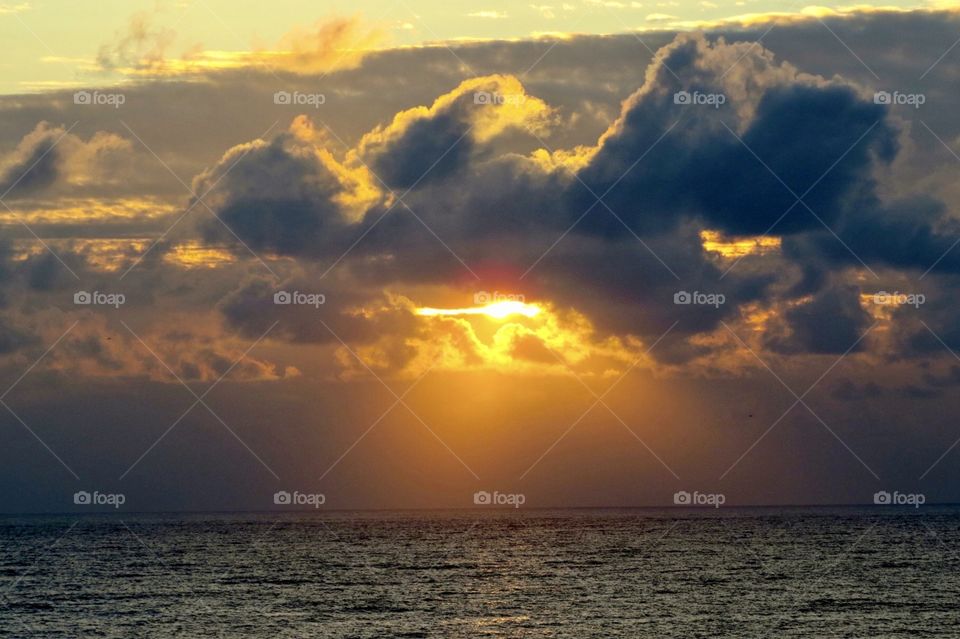 Sunrise at the beach on a cloudy morning