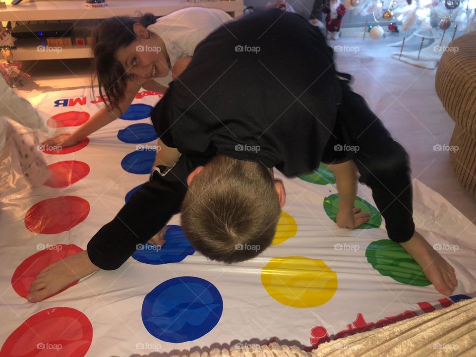 Kids having fun with the game  Twister 