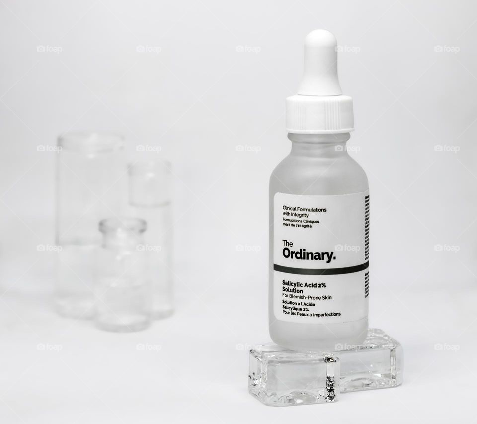 The Ordinary Sallcylic Acid 2% Solution displayed on glass cubes in a clinical setting