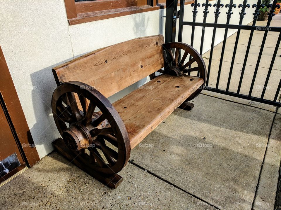 Close-up of a wagon wheel bench