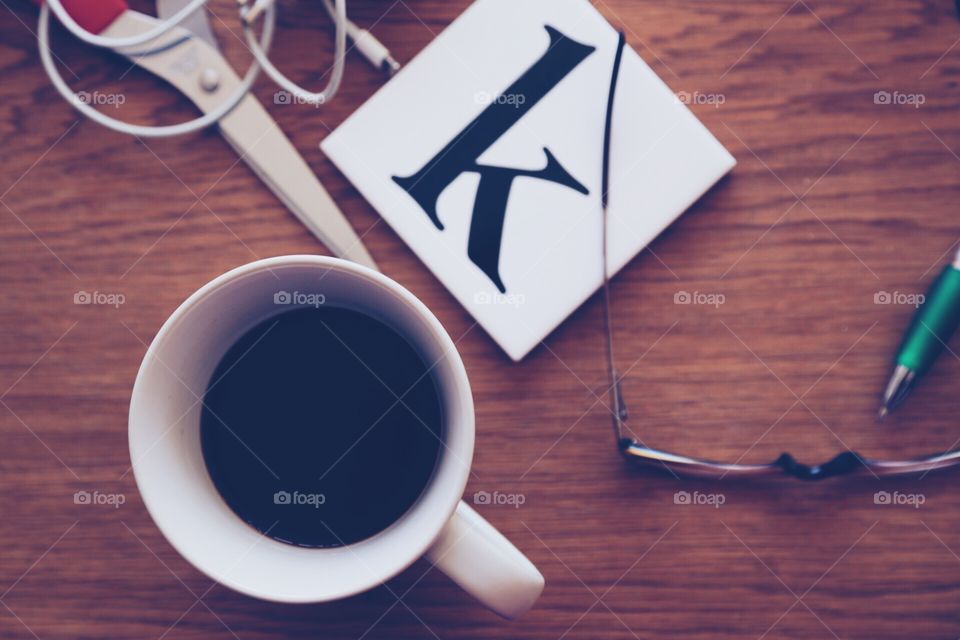 Coffee mug , glasses and the letter k