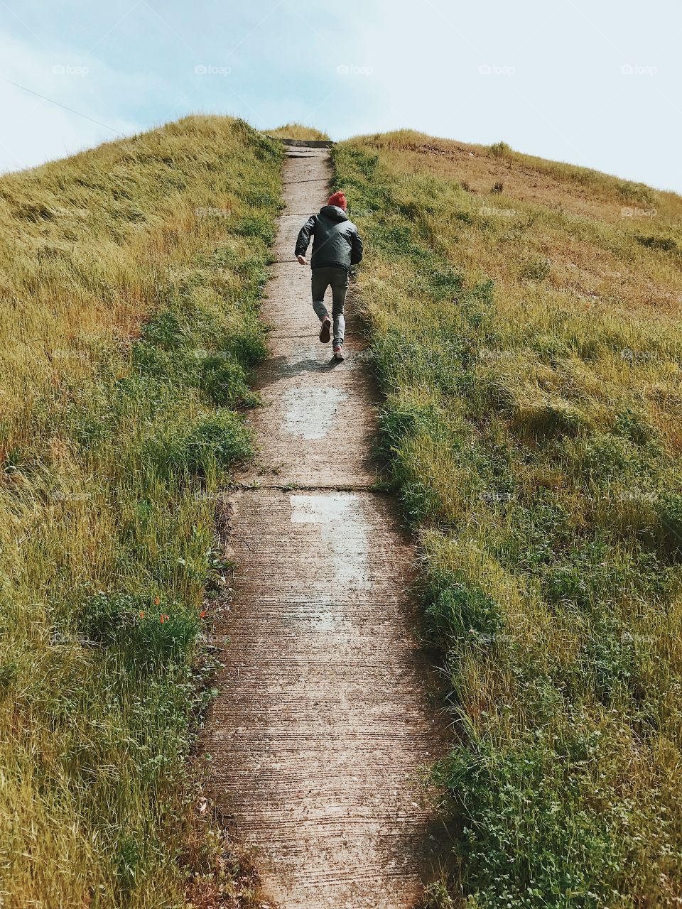 Man climbing a mountain.