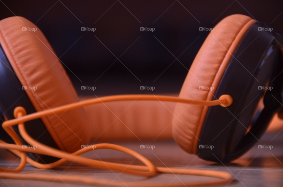 orange close up headphones by plexibot