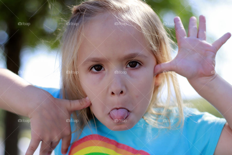 Little girl make a funny face