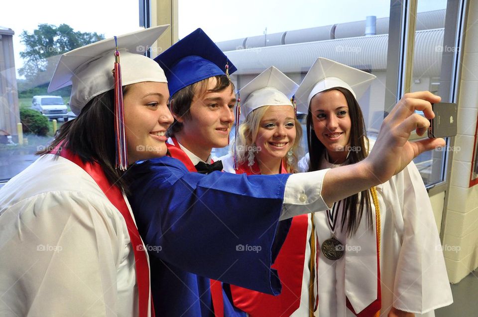 Graduates taking a photo of themselves, selfie