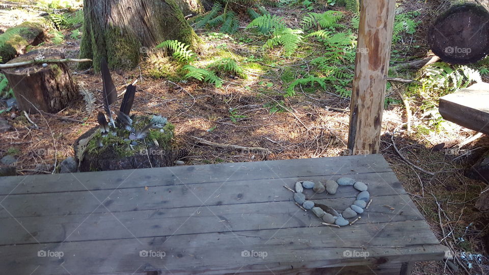 Rock heart on forest bench