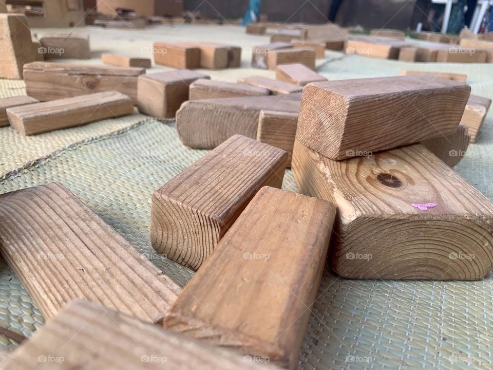 Many wooden blocks on carpet