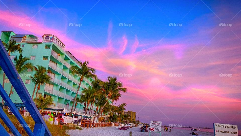 A beautiful pink sunset sky over Fort Myers Beach Florida 