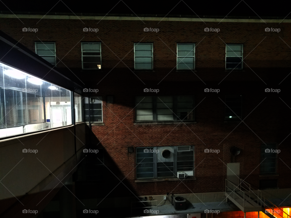 Light shining on brick at night