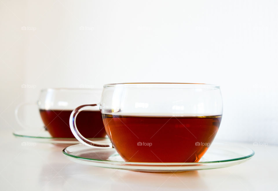 Two cup of tea on white background