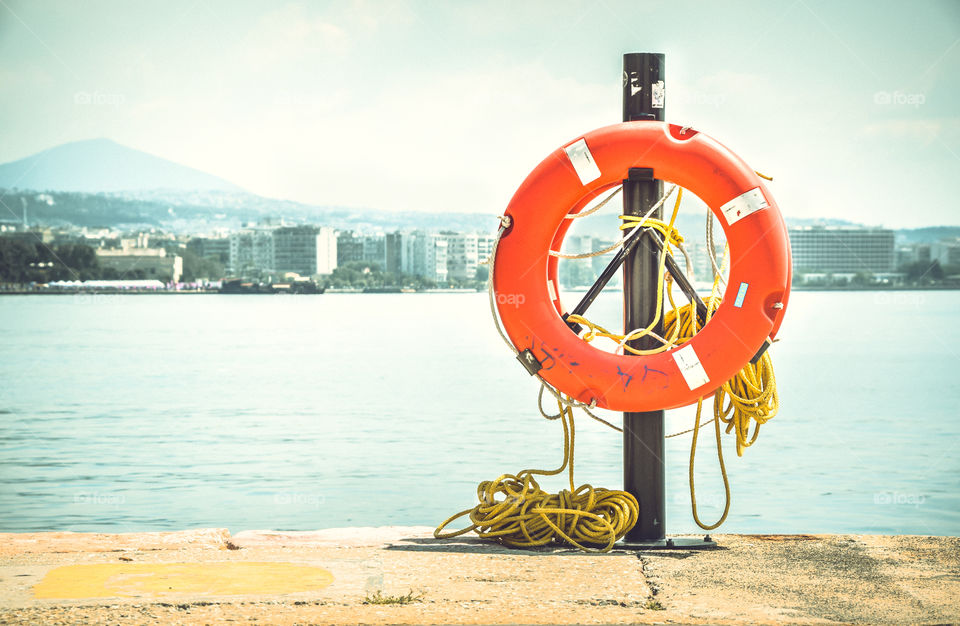 A life preserver hanging on a dock