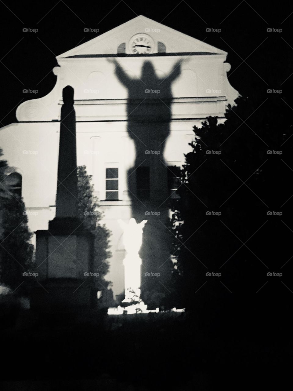 Touchdown Jesus statue in New Orleans LA shadow