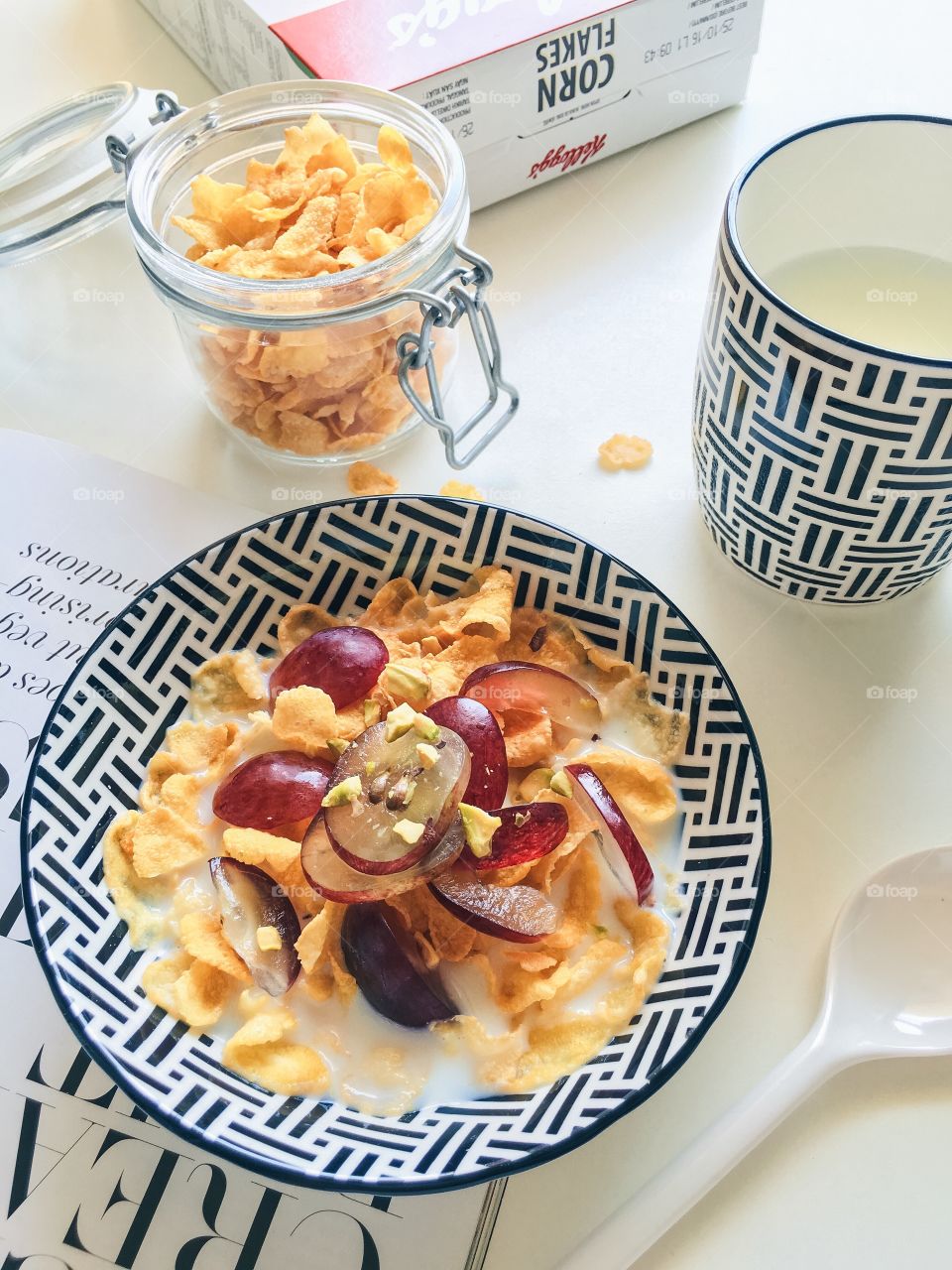 Reimagining cereal : Breakfast bowl with Kellogg's Corn flakes.
(Ingredients : Kellogg's Corn flakes, milk, and grapes sprinkling with pistachios.)
