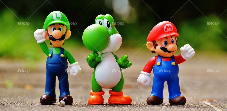 Focus Photo of Super Mario, Luigi, and Yoshi Figurines