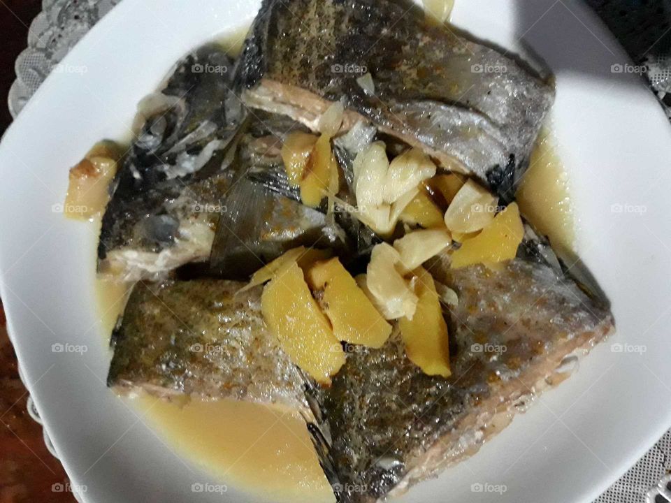 Filipino dish called Paksiw. Fish cooked in vinegar and ginger. This Paksiw version has garlic added.