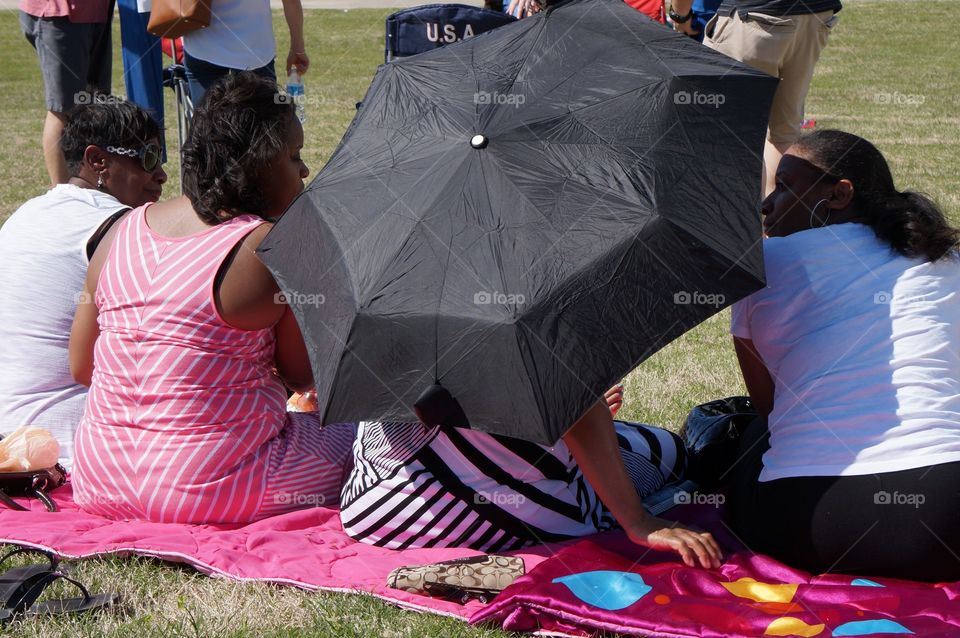 Four friends. Blanket in the park