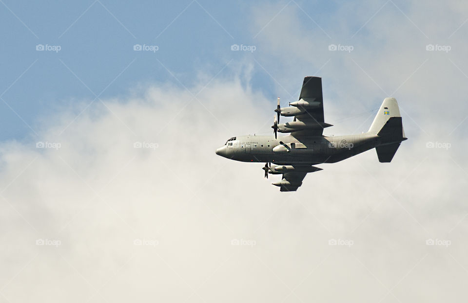 Military plane flying in sky