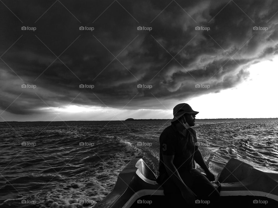 Speeding away from the storm developing over the horizon. Rainy days in Kokilai, northern part of Sri Lanka.