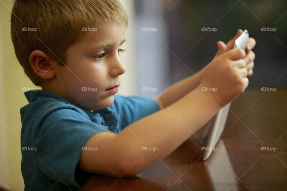 Boy holding a tablet computer