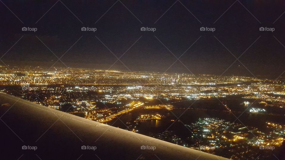 Plane over New York at Night