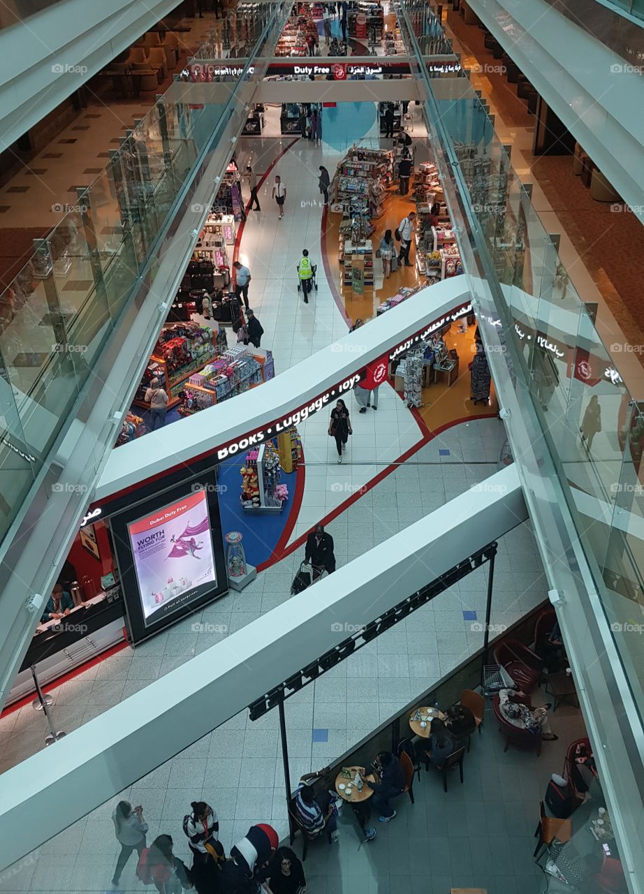 Passengers browse in the shops in Dubai International Airport, in the UAE