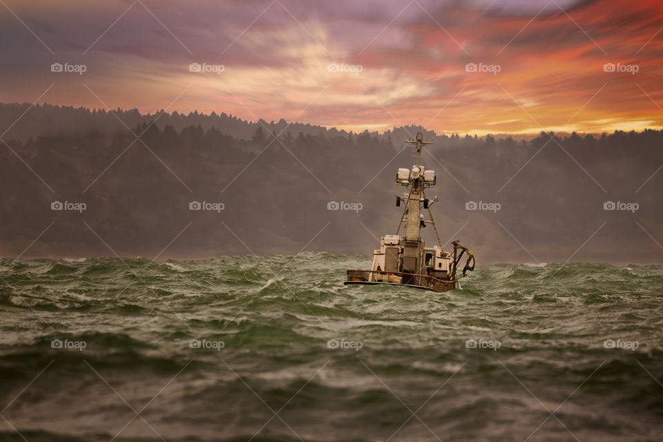 Fishing boat at sea during dusk