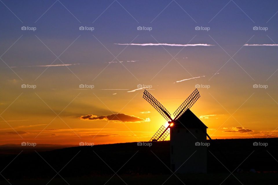 Silhouette of windmill during sunset