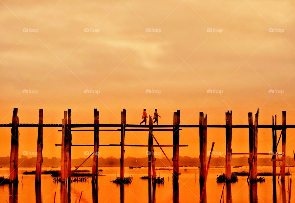 Local people are walking on U Bein the longest wooden bridge in the world to go to morning market,Mandalay Myanmar 