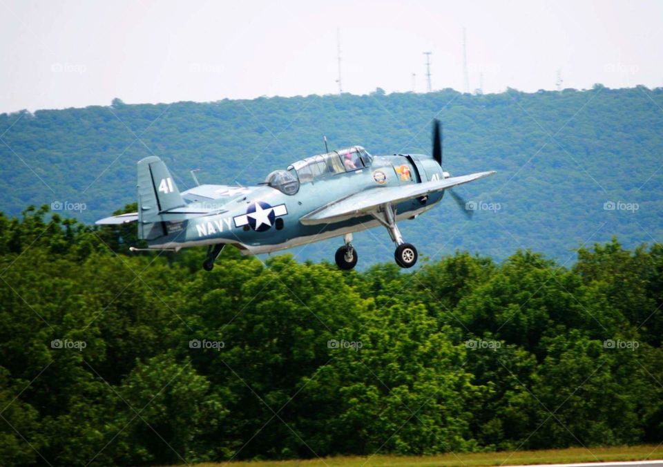 US Navy WWII war plane taking off for battle