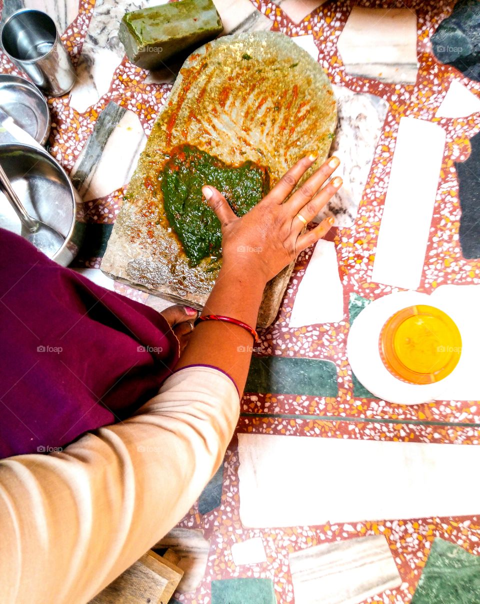 my wife was Pestling chilli's and spinach making chatani ( sauce )