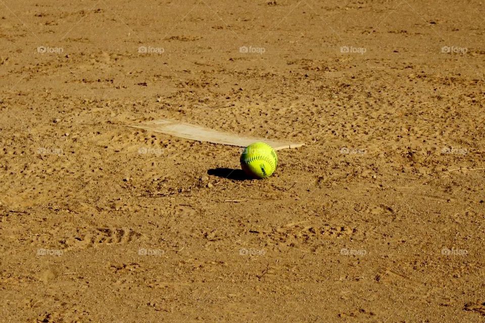 softball by pitching mound