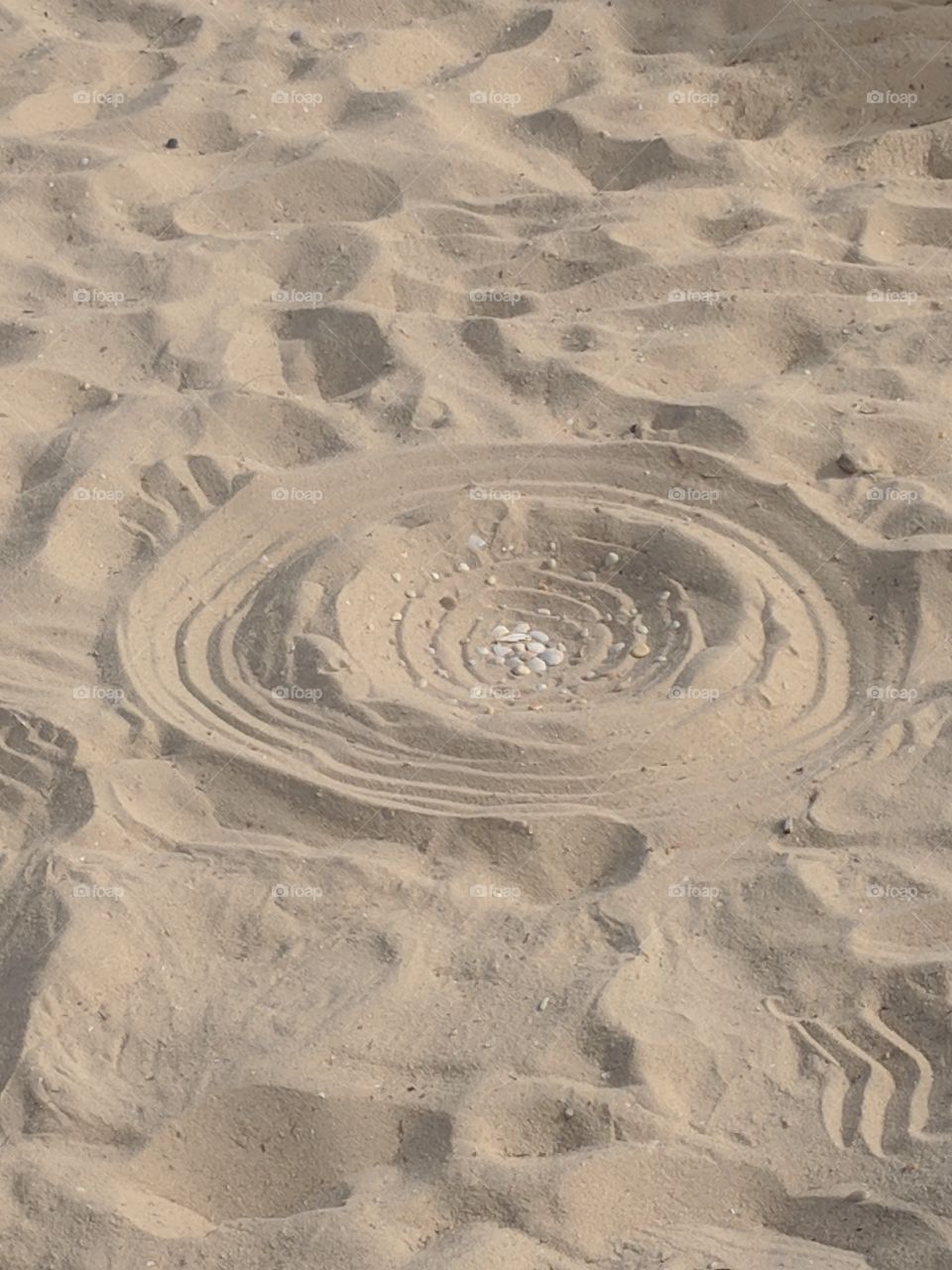 A circle in the sand. Calming art work created by my wonderful girlfreind whilst she meditated.