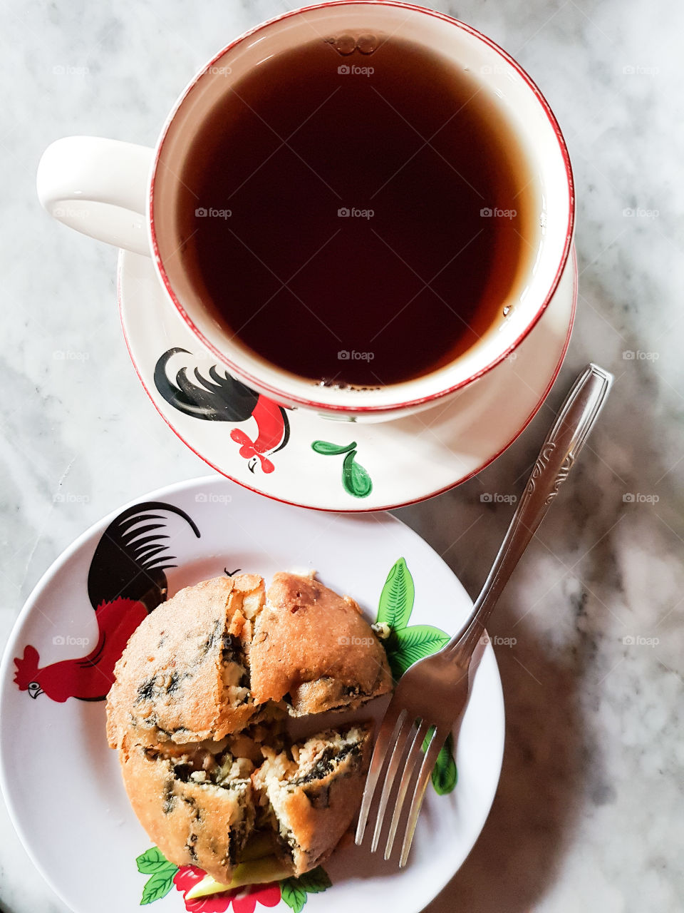 Coffee break Indonesian style. The well known chicken printed cup and saucer uplift the localities feeling.